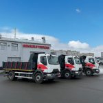 вантажний самоскид DNIPRO на фоні Renault Trucks